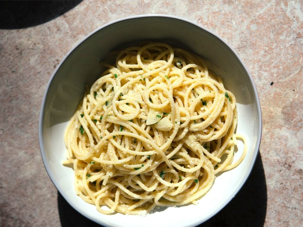 bowl of garlicky pasta with cheese and olive oil