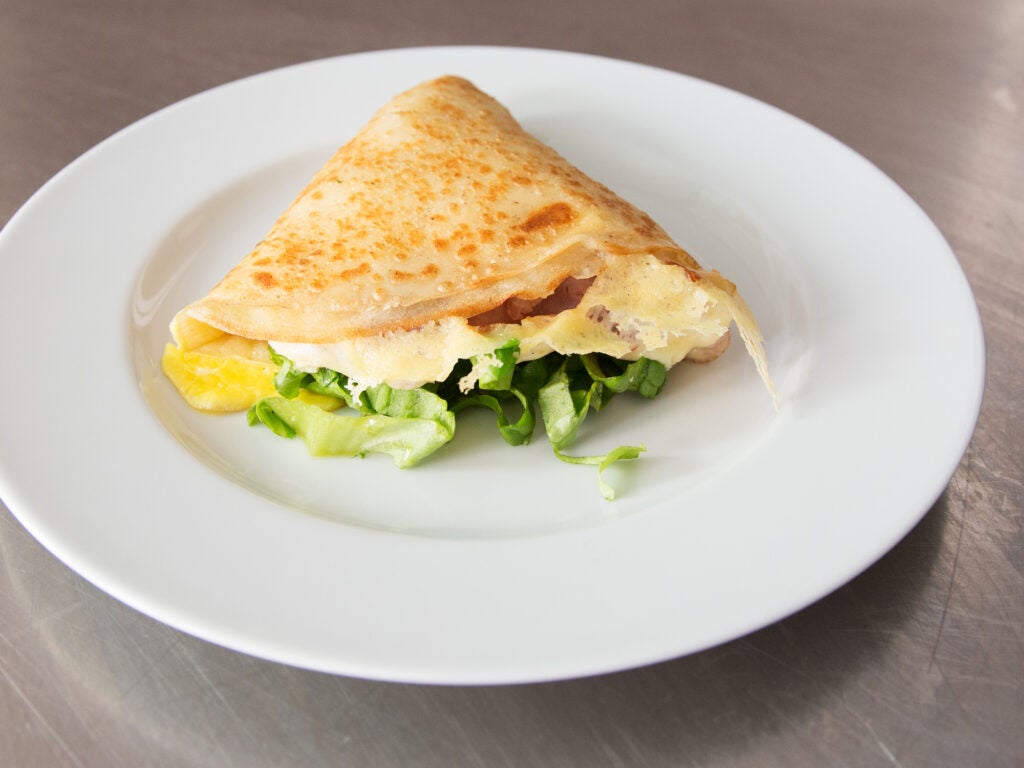ham and cheese crêpe on white plate