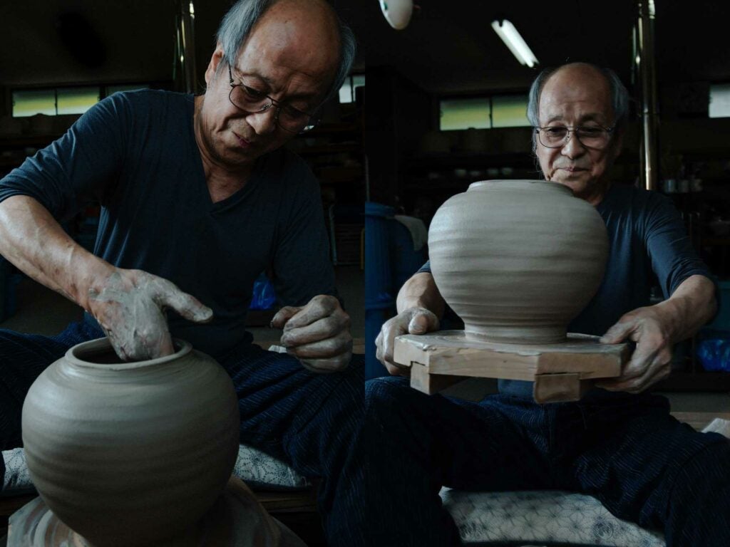 Kimura shapes the wall of a large pot