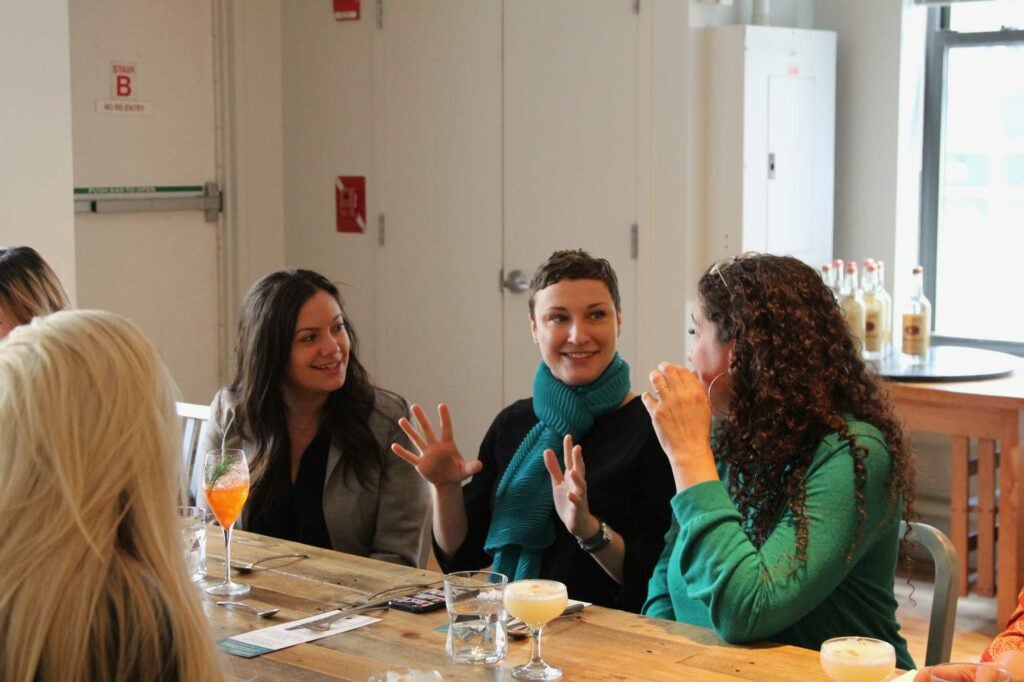 From left, Juliana Pesavento and writers Kristin Vukovic and Kate Heddings take a break from martinis to chat.