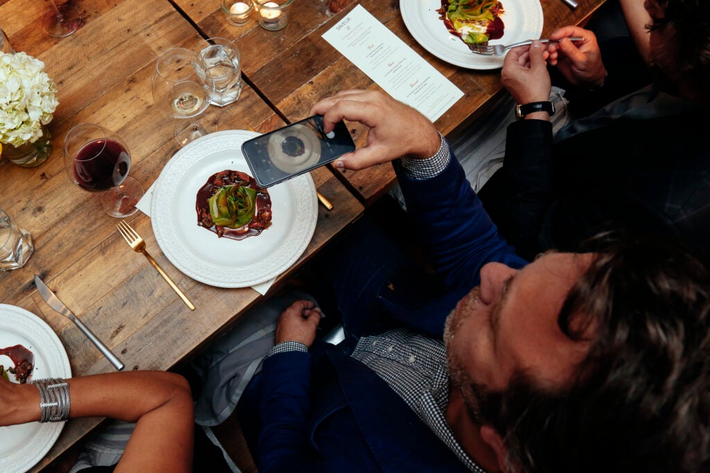 Editor in Chief Adam Sachs sneaks an overhead food shot during dinner.