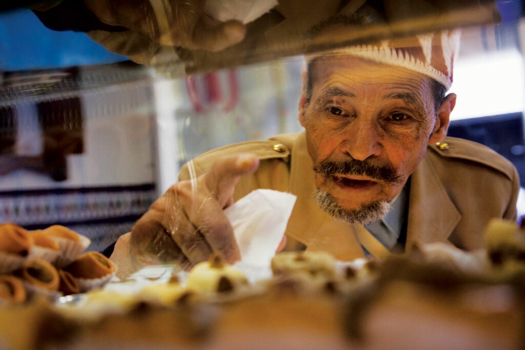 A customer at El Andalousia, an Algerian pastry shop.