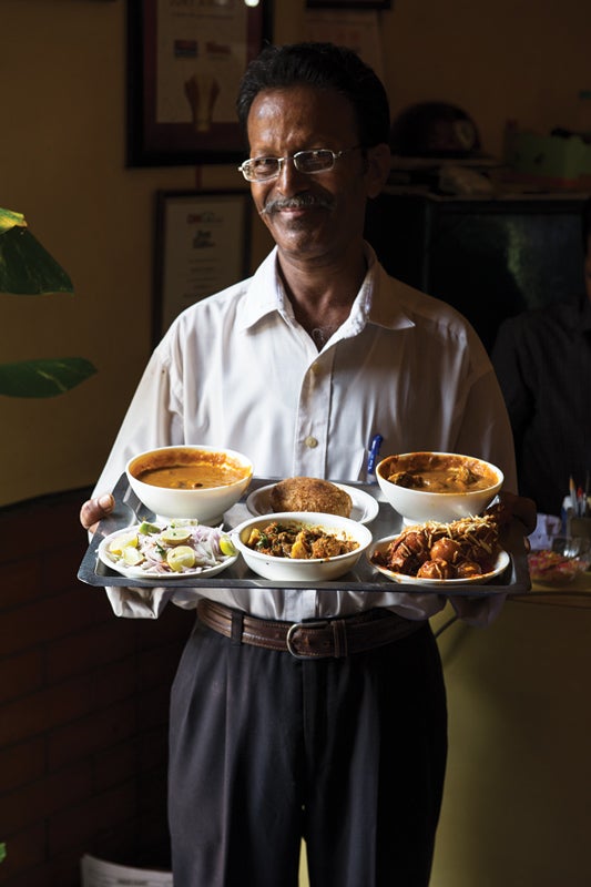 feature_west-india_mumbai_bombay-ideal_man-with-food_533x800.jpg