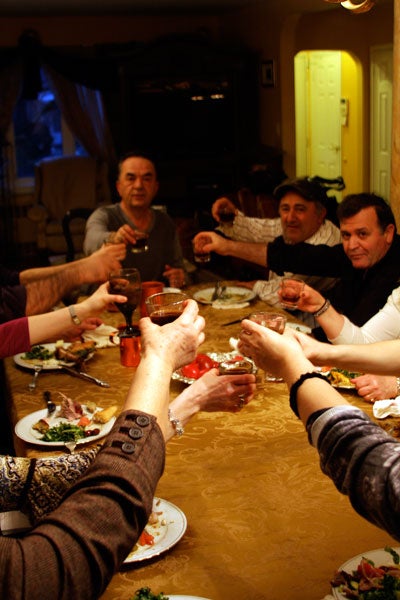 people toasting around a table