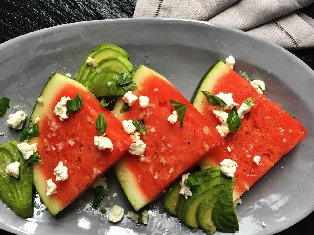 Kitchen intern Arianne Jones whips up a watermelon salad from the book