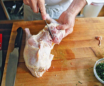 cutting up a chicken