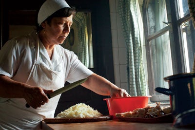 Agnes Elek in the kitchen at Count Kalnoky's estate in Miklosvar