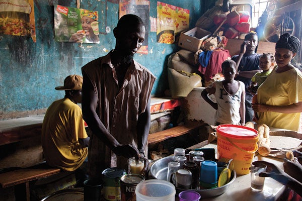 A coffee vendor at Marche Kermel, in Dakar