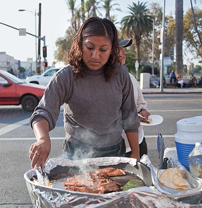 A street vendor preparing carne asada in MacArthur Park