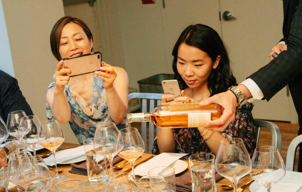 Hannah Lee of Hannah Lee Communications and Jenny Huang of Hello My Dumpling snap photos before the supper.
