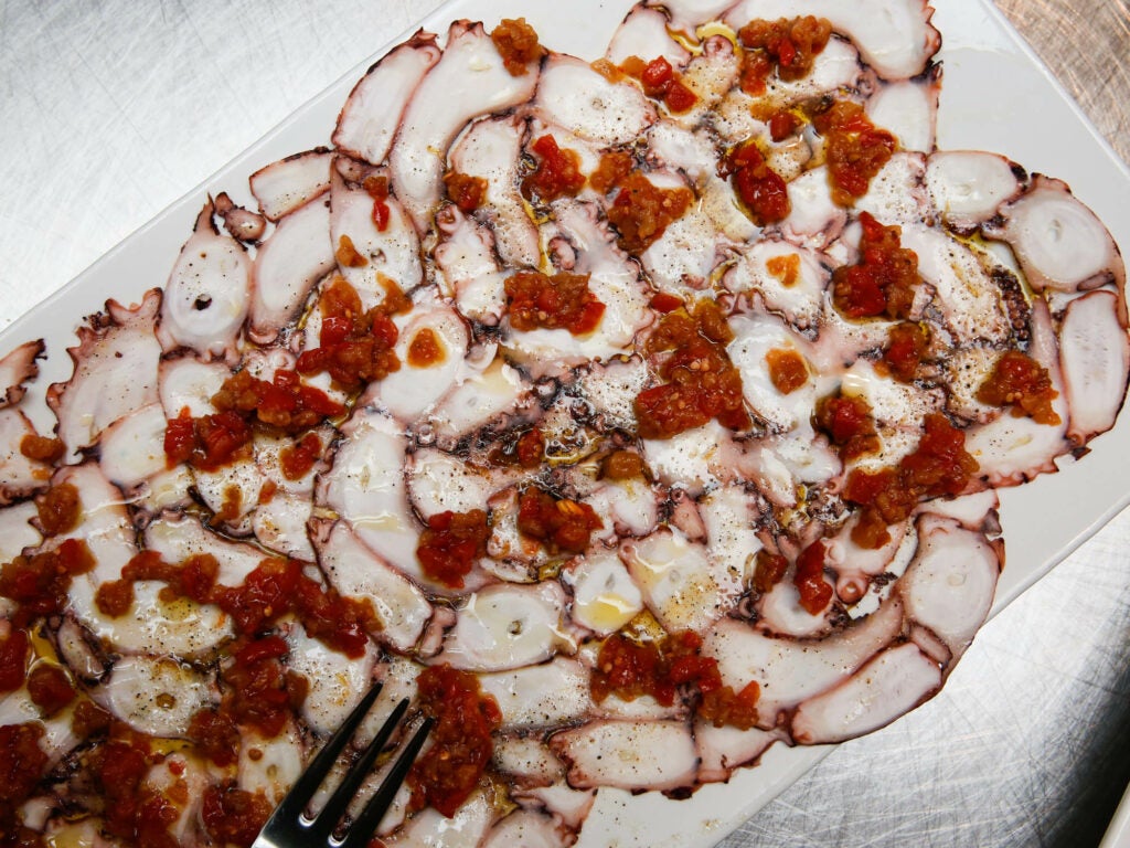 The stunning octopus carpaccio, a re-imagination of a dish from Perla