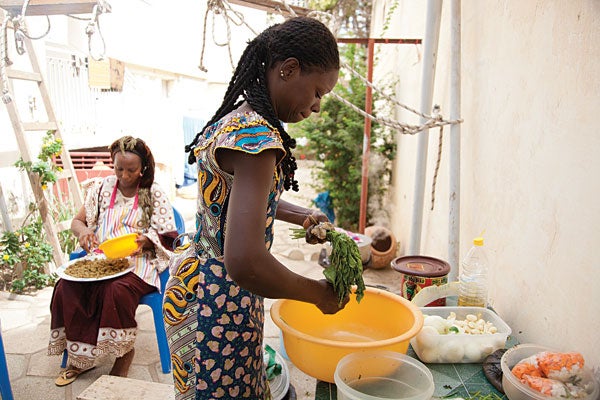 Marie Jeanette Diop (left) and a household employee at Diop's home in Dakar