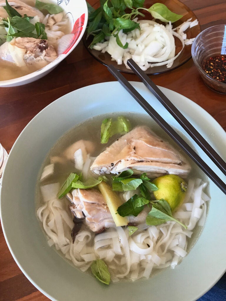 Finished Vietnamese Pho in a bowl with chopsticks