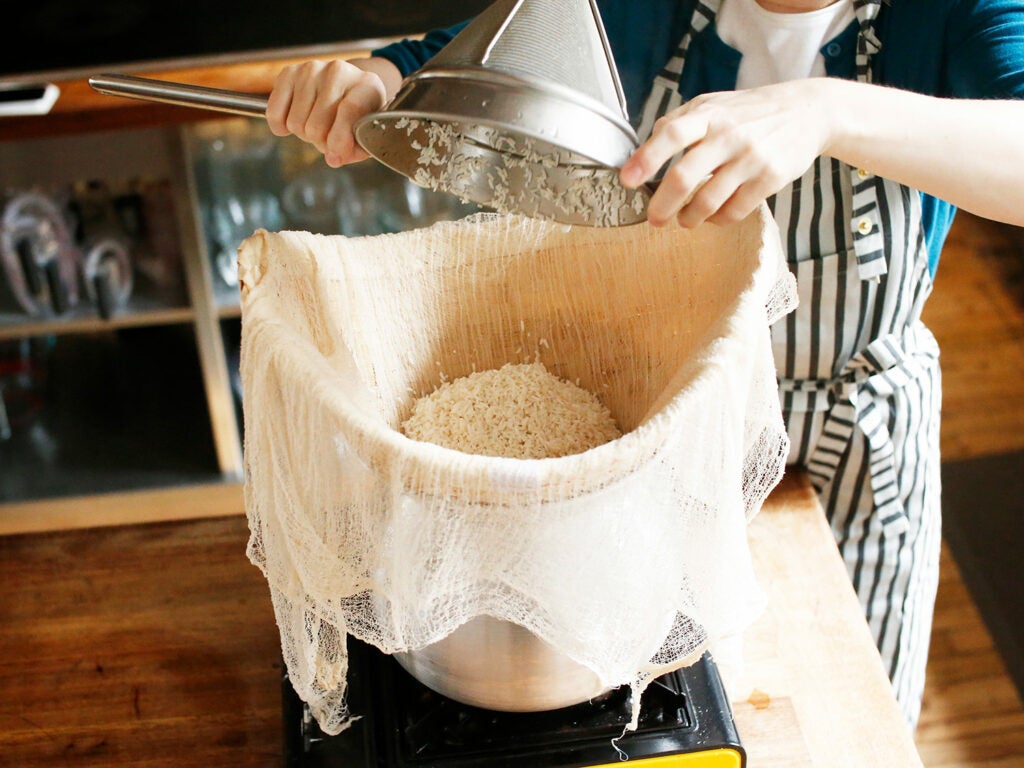 pouring rice into steamer basket