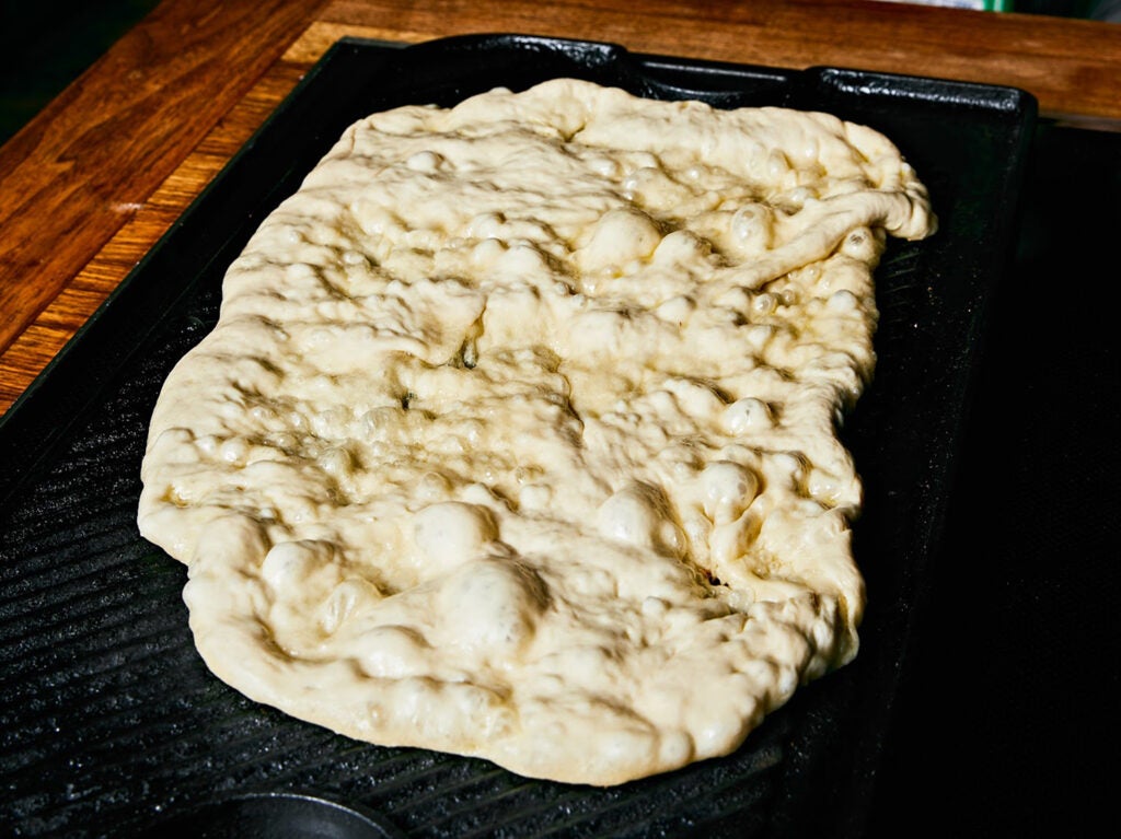 Crust spread out on grill pan.