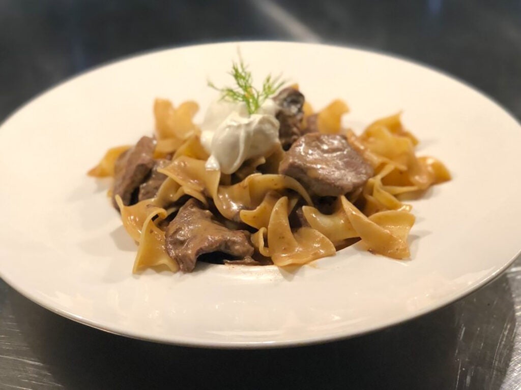 Egg noodles topped with meat in Point 57’s stroganoff.