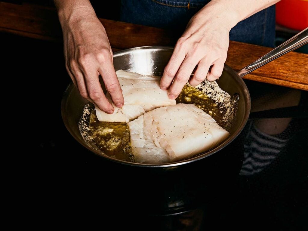 Searing cod in a mixture of olive oil and butter.