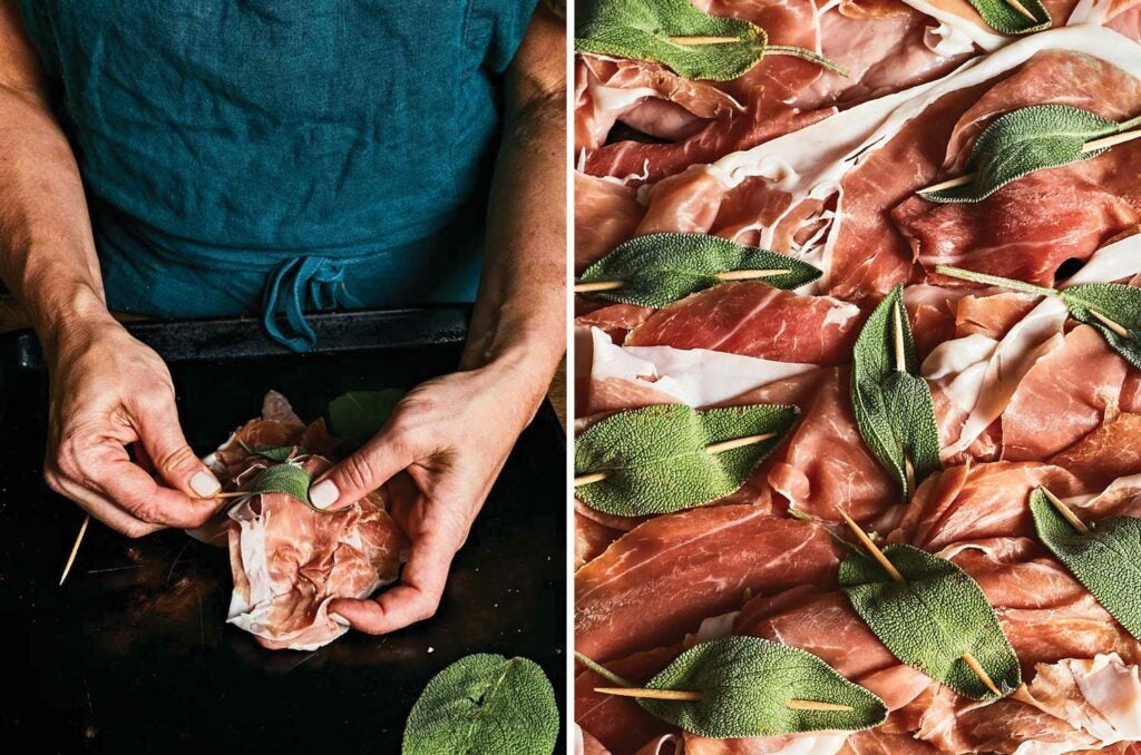 Toothpicks holding together whole sage leaves into the prosciutto on top of veal cutlet.