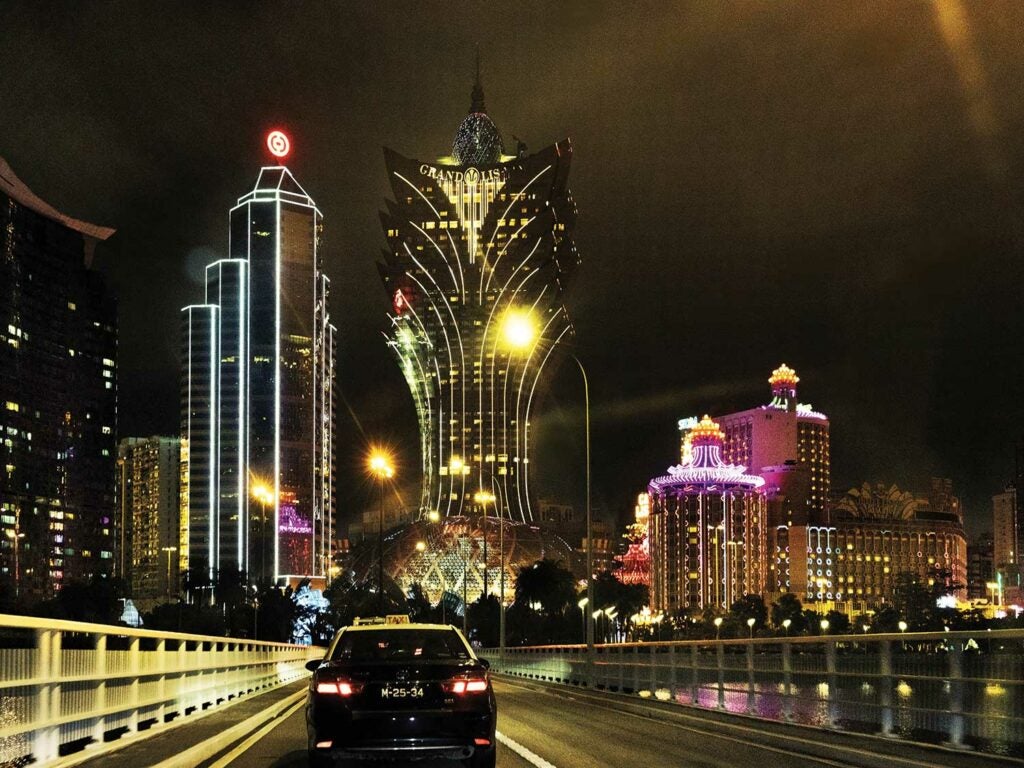 Driving into Macau, lit up at night.