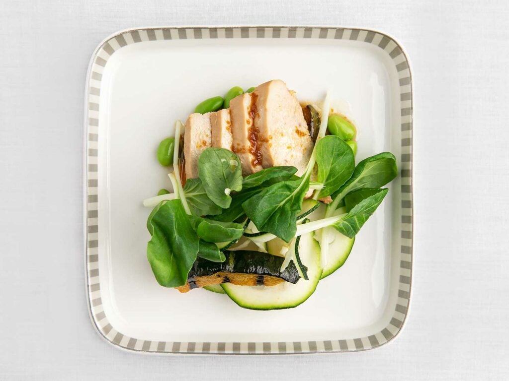 Singapore Airlines’s Hainanese chicken-inspired entrée with AeroFarms baby bok choy.