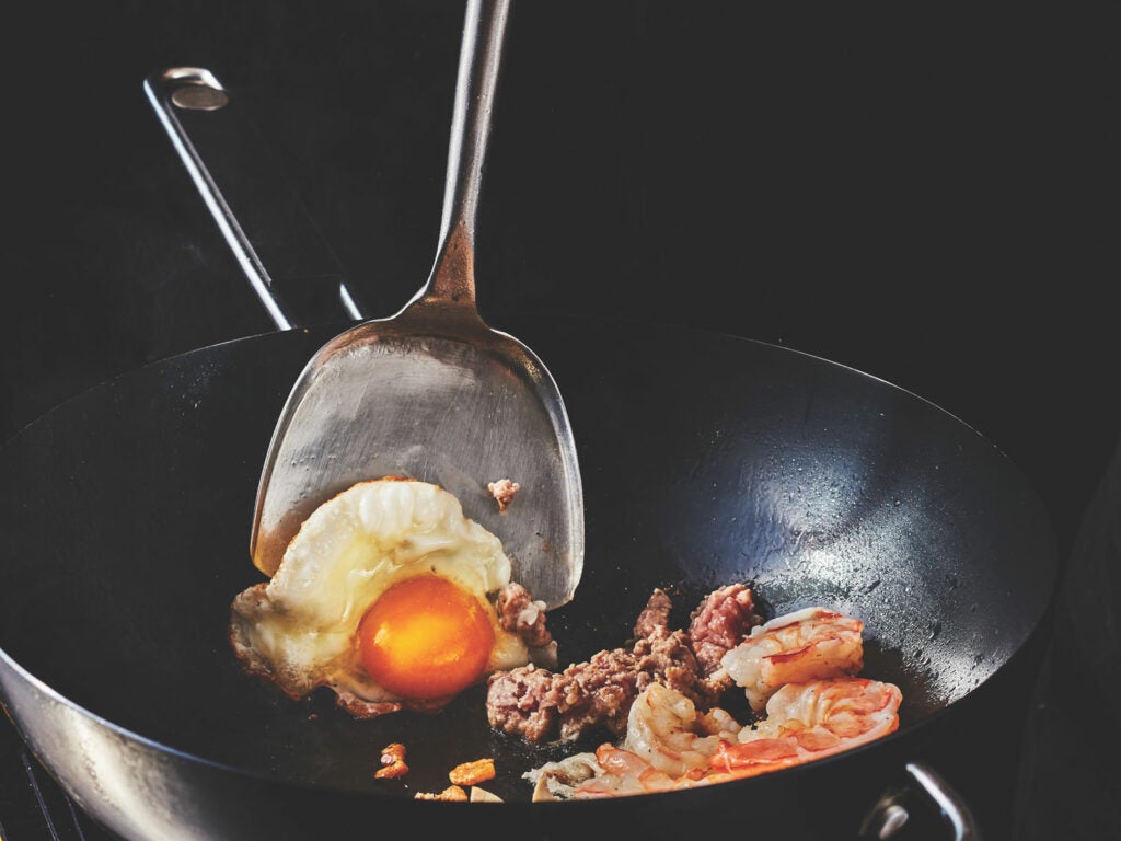 A smoking-hot wok makes for a bubbled and crispy egg.