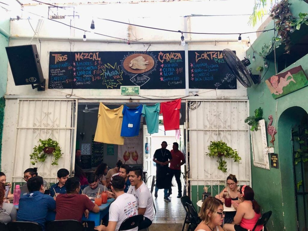 Cantina La Negrita’s colorful back patio is family-friendly and lively.