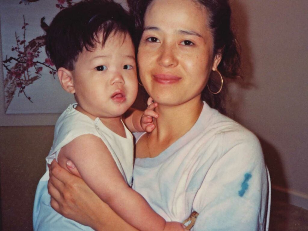 Author Eric Kim with his mother, Jean, at their Atlanta home in 1992.